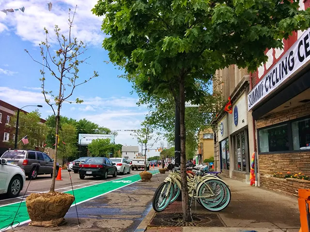 A bike facing a bike path on the street