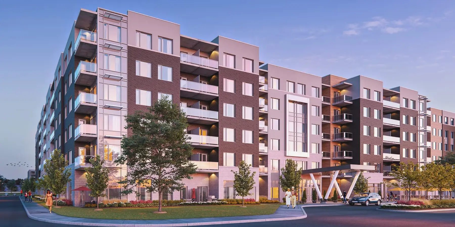 Dusk rendering of a six-storey brick and panel apartment building with balconies, a covered entrance canopy, landscaped lawn and a few residents walking.